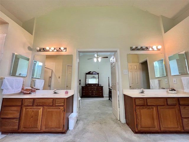 bathroom with vanity, a shower with door, high vaulted ceiling, and ceiling fan