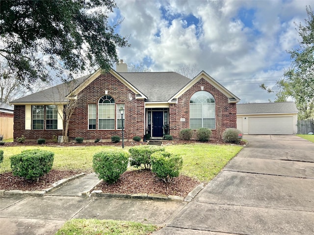 single story home featuring a front yard and a garage