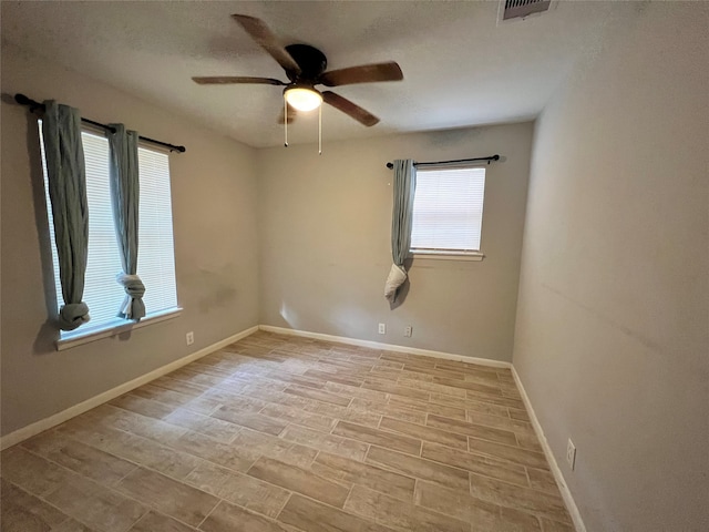 unfurnished room featuring ceiling fan, a textured ceiling, and light hardwood / wood-style flooring