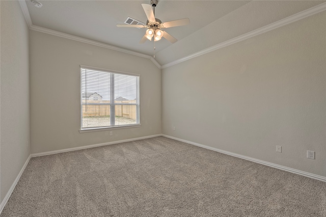 carpeted spare room featuring vaulted ceiling, ceiling fan, and crown molding