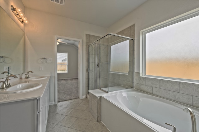 bathroom featuring tile patterned flooring, vanity, and independent shower and bath