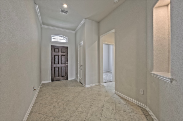 tiled entryway with ornamental molding