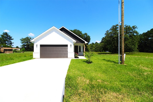 view of front facade featuring a front yard and a garage