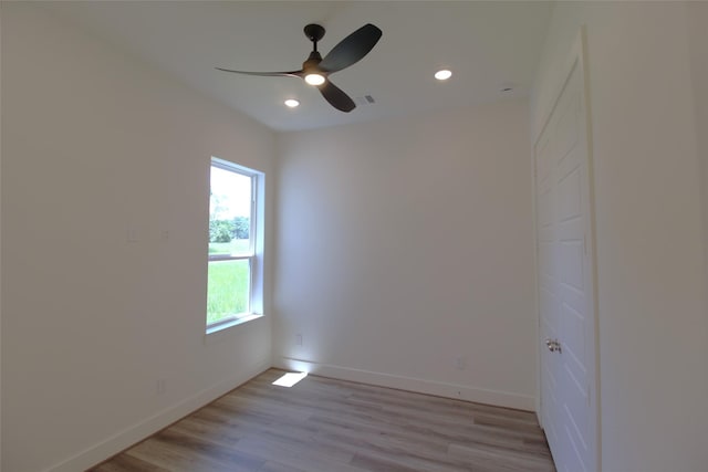 spare room with ceiling fan and light hardwood / wood-style floors