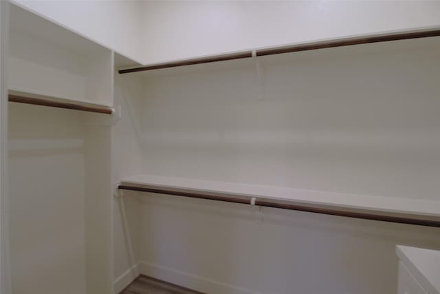 walk in closet featuring hardwood / wood-style floors