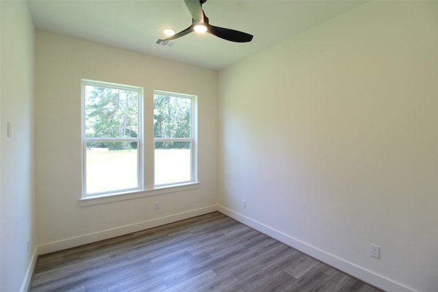 unfurnished room with ceiling fan and light wood-type flooring