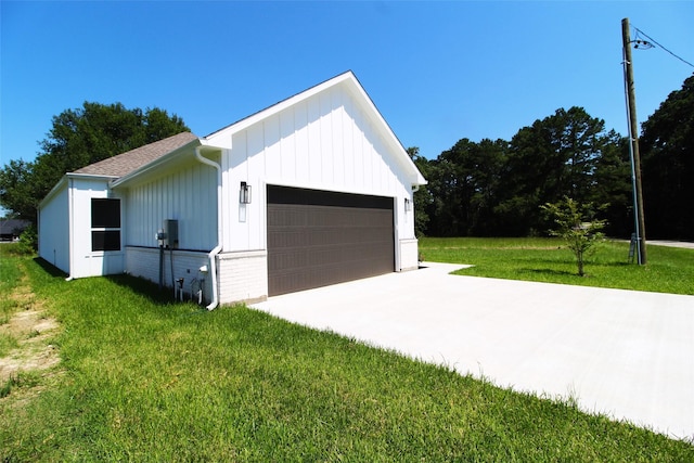 garage featuring a lawn