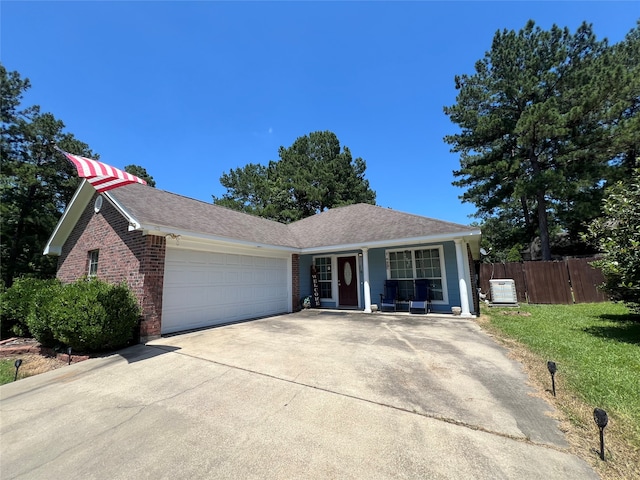 single story home with a garage and a front yard