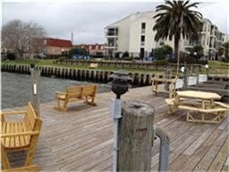 dock area featuring a deck with water view