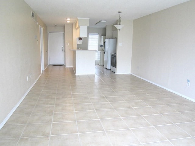 unfurnished living room featuring light tile patterned flooring