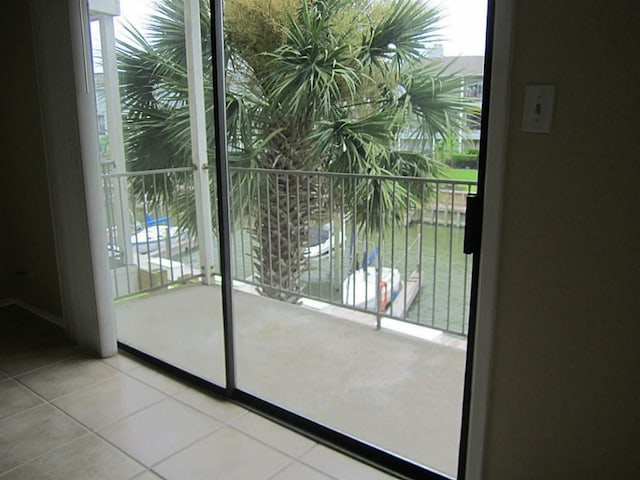 doorway with tile patterned flooring