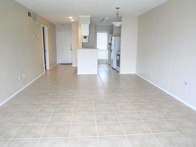 unfurnished living room with light tile patterned flooring