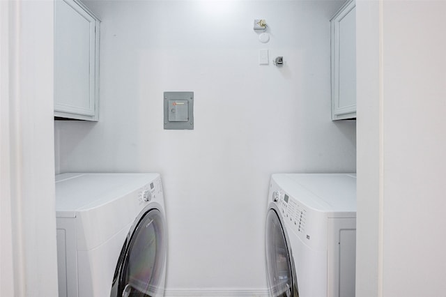 washroom with cabinets and independent washer and dryer