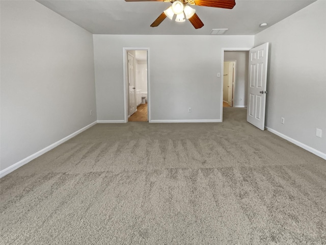 unfurnished bedroom with light carpet, ensuite bathroom, and ceiling fan