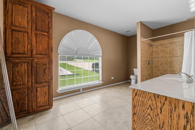 bathroom featuring vanity, tile patterned floors, toilet, and a shower with shower curtain