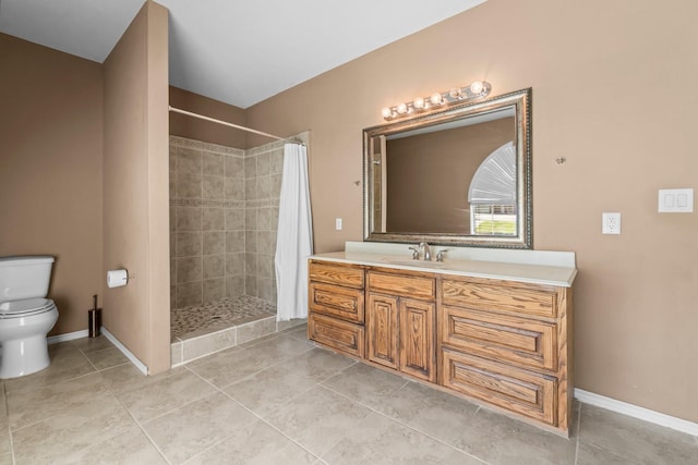 bathroom with vanity, toilet, tile patterned flooring, and a shower with shower curtain