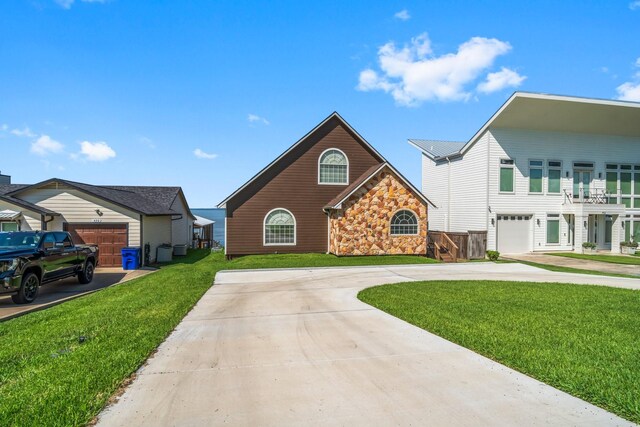 view of front property with a garage and a front yard