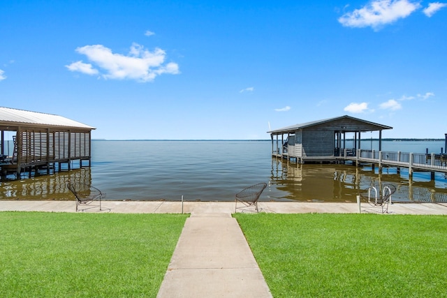 dock area featuring a water view and a lawn