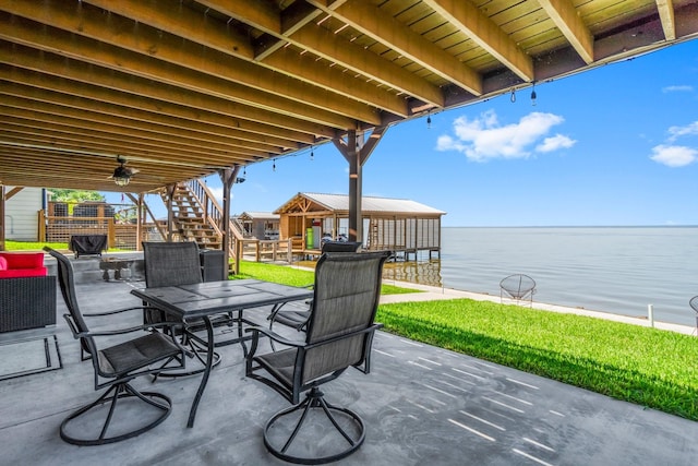 view of patio / terrace featuring a water view and a gazebo