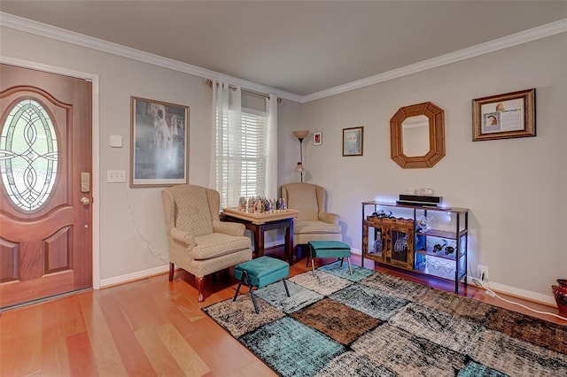 living area with light hardwood / wood-style flooring, a wealth of natural light, and ornamental molding
