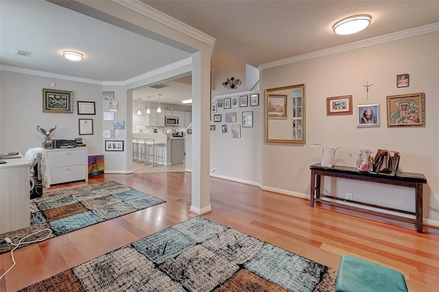 interior space featuring crown molding and wood-type flooring