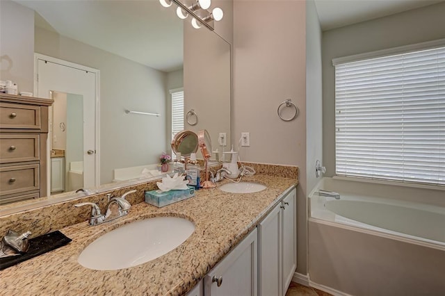 bathroom with vanity and a tub to relax in
