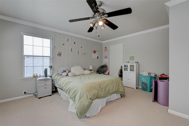 carpeted bedroom with ceiling fan and crown molding