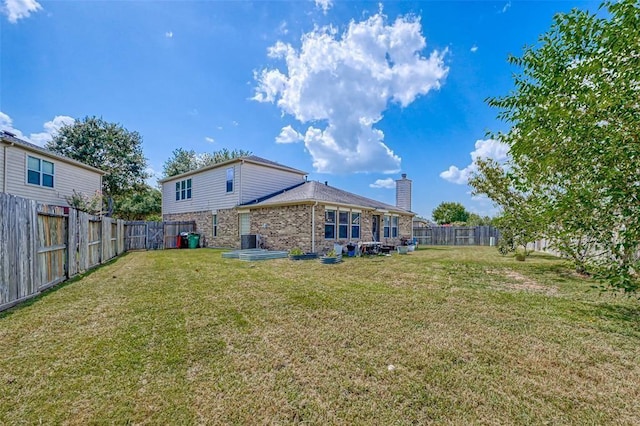 view of yard featuring central AC