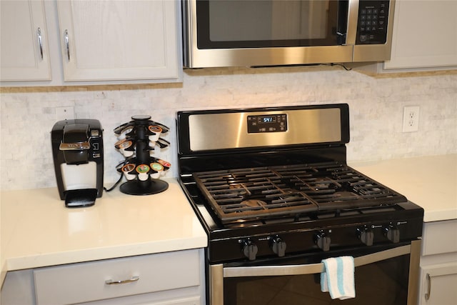 kitchen with backsplash and stainless steel appliances