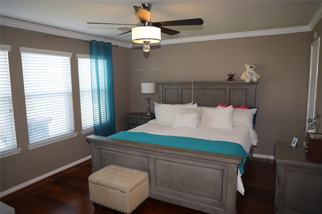 bedroom featuring crown molding, ceiling fan, and dark wood-type flooring