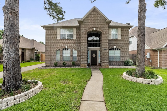 front facade featuring a front lawn