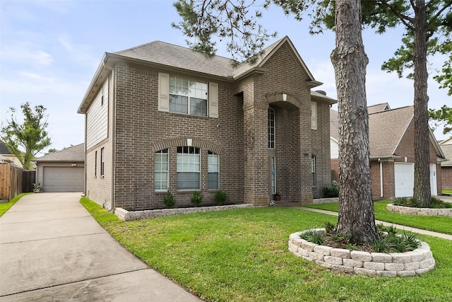 view of property with a garage and a front yard