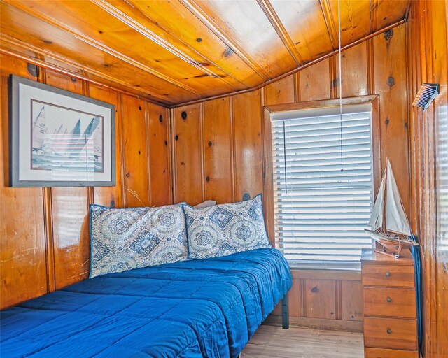 1214 County Road 201, Sargent, TX 77414 - bedroom featuring wooden walls, wood finished floors, wooden ceiling, and lofted ceiling