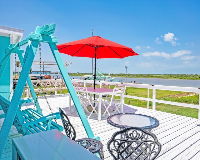 1214 County Road 201, Sargent, TX 77414 - deck featuring outdoor dining space and a water view