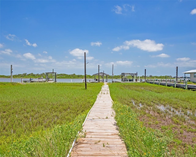 view of community with a water view