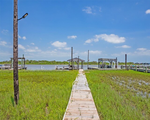1214 County Road 201, Sargent, TX 77414 - dock area featuring a water view and boat lift