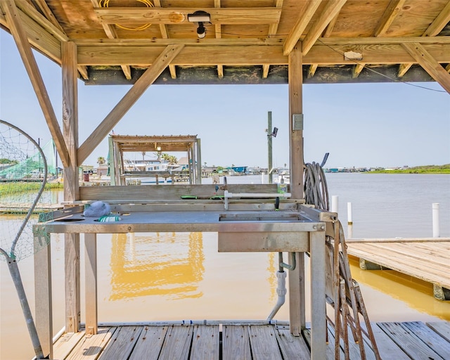 dock area featuring a water view and boat lift