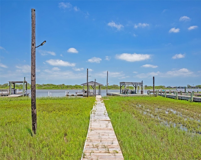 exterior space with a water view and a gazebo