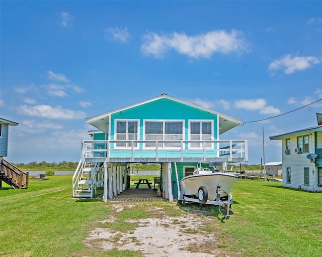 1214 County Road 201, Sargent, TX 77414 - view of front of house with a carport, dirt driveway, stairs, and a front lawn