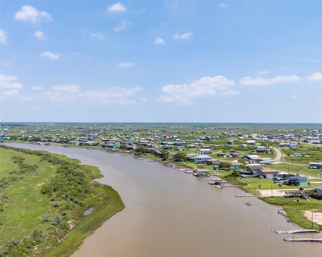 birds eye view of property with a water view and a residential view