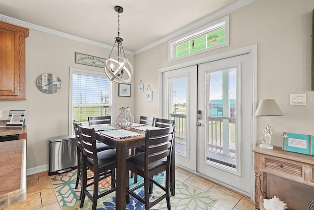 tiled dining room with crown molding, a notable chandelier, and french doors