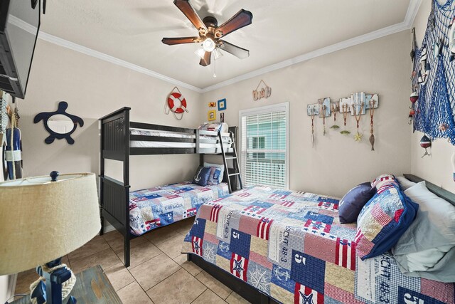 tiled bedroom featuring crown molding and ceiling fan