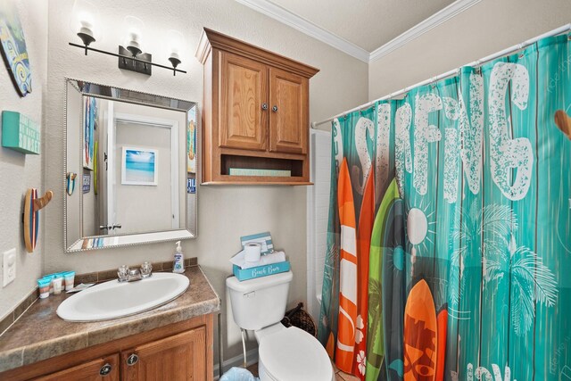 bathroom with a textured ceiling, toilet, vanity, and ornamental molding