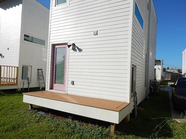 wooden deck featuring a yard