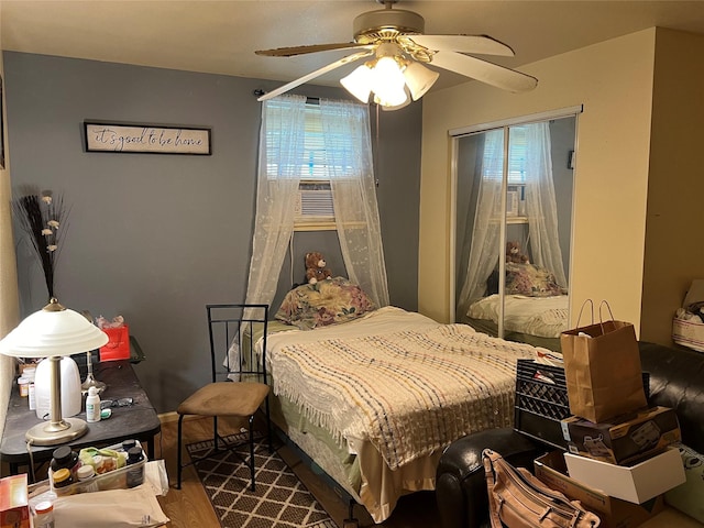 bedroom with hardwood / wood-style flooring and ceiling fan