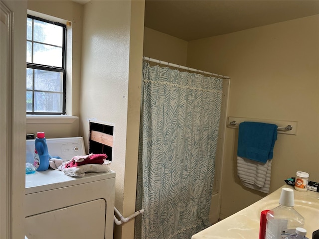 bathroom featuring washer / dryer