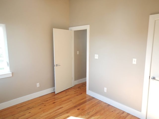 spare room featuring light hardwood / wood-style floors