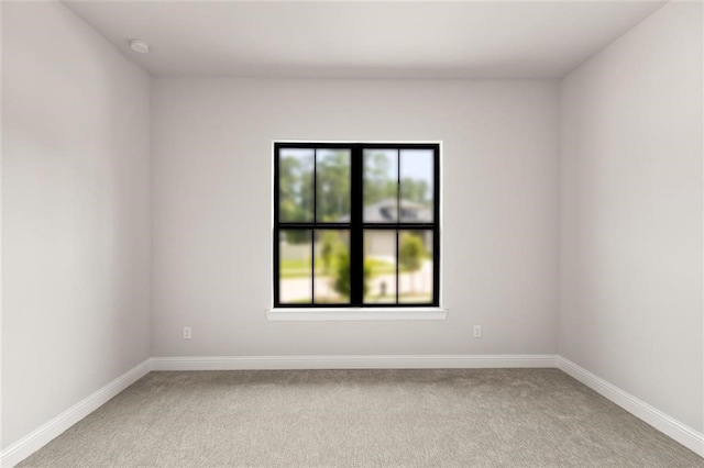 unfurnished room with light colored carpet