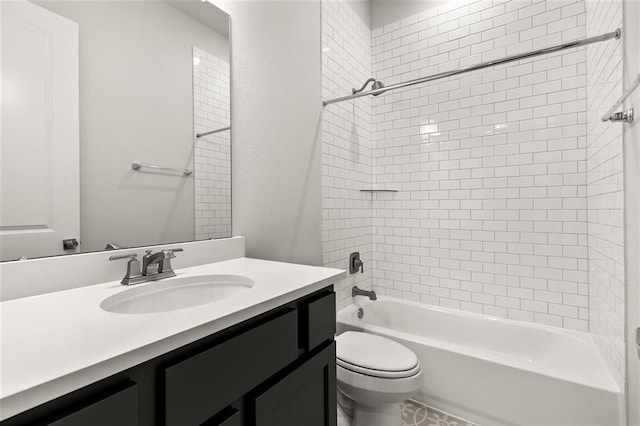 full bathroom featuring vanity, toilet, and tiled shower / bath