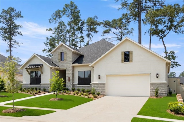 view of front of property with a front yard and a garage